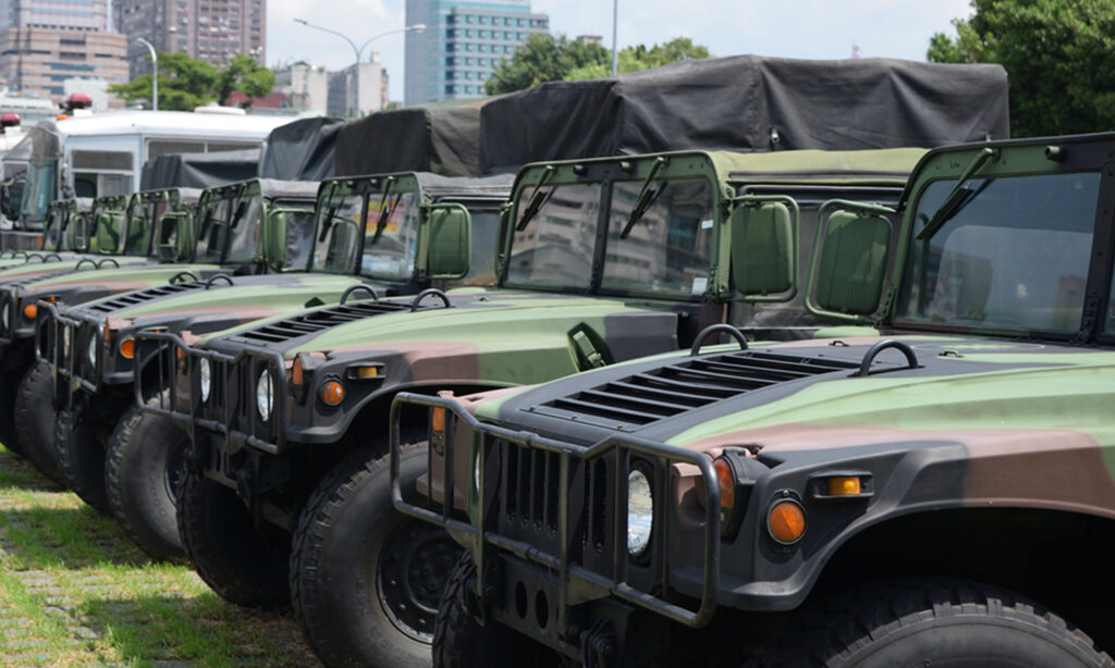 a row of military vehicles parked next to each other